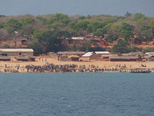 village, people gathering on the beach