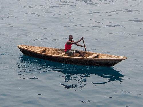 guy in small boat