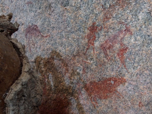 Rock paintings: people, antelopes, warthog